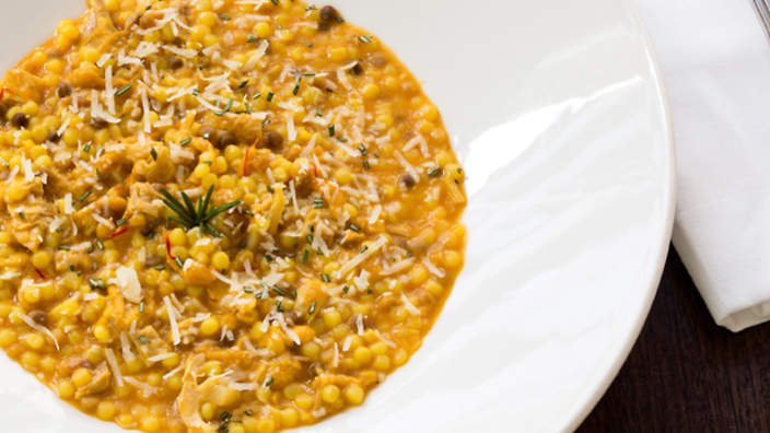 Popolo's fregola pasta with saffron and suckling pig ragù